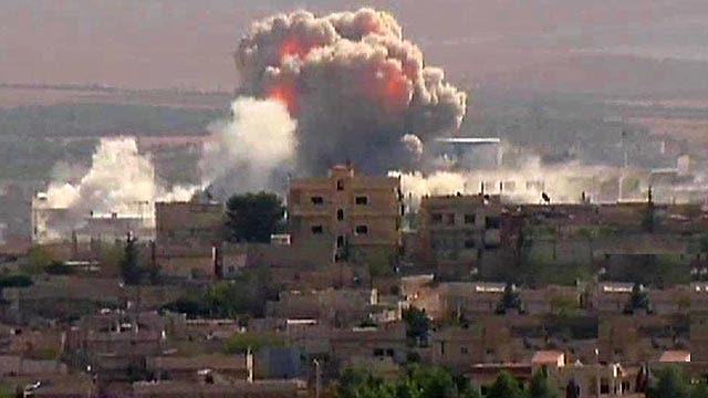 Battle for crucial Syrian border town continues