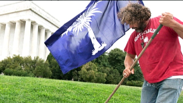 Lawnmower man cuts grass at DC memorials