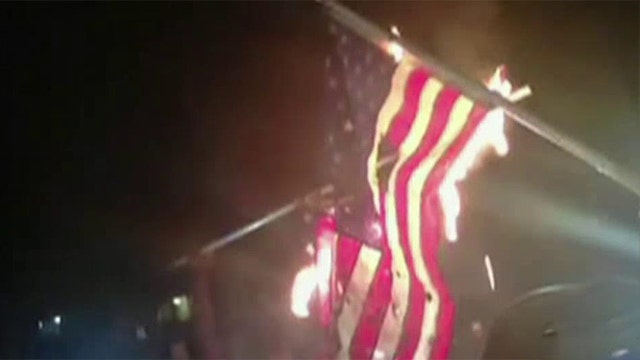 Protesters burn American flags in St. Louis