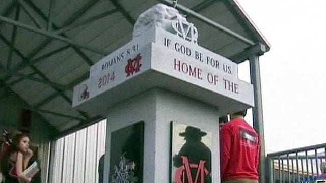 Atheists outraged by bible verses on high school statue