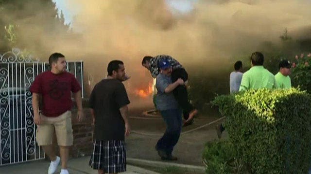 Stranger rescues man from burning house