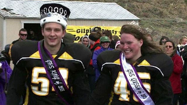 Homecoming king and queen play on same football team