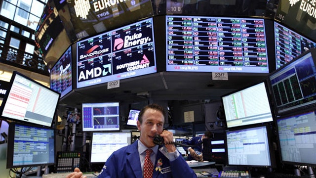 Stocks jump on hopes the Fed will keep stimulating economy