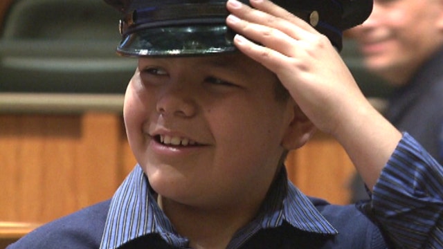 'So amazing': Boy with cancer becomes honorary cop