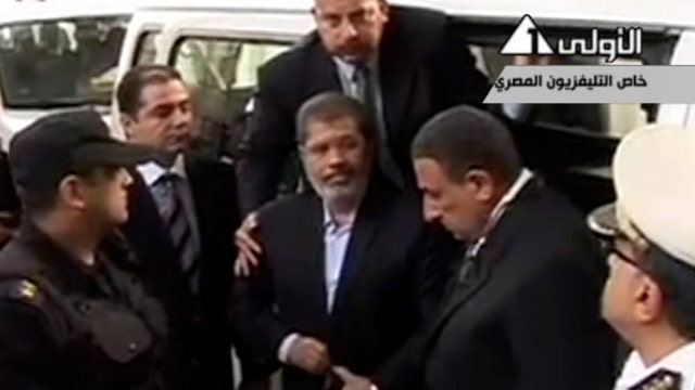 Morsi trial begins, then adjourns until January 8