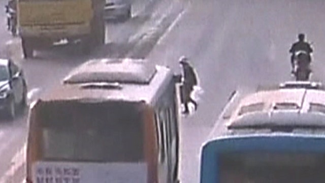 Elderly woman causes pile-up on busy road in China
