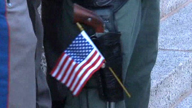Gun advocates interrupt Veterans Day celebration
