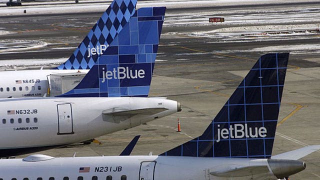 JetBlue cutting legroom, charging for checked bags
