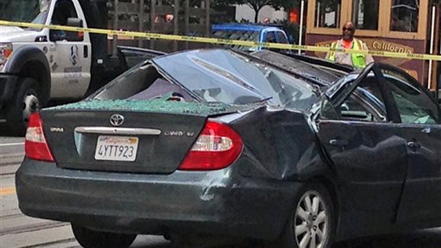 Window washer survives 11-story fall onto moving car