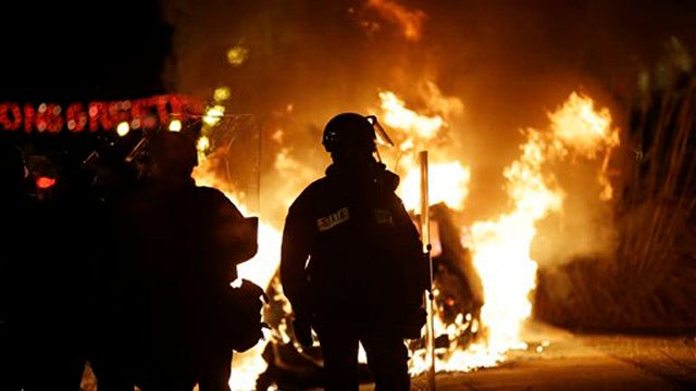Fires burn in Ferguson as protests continue