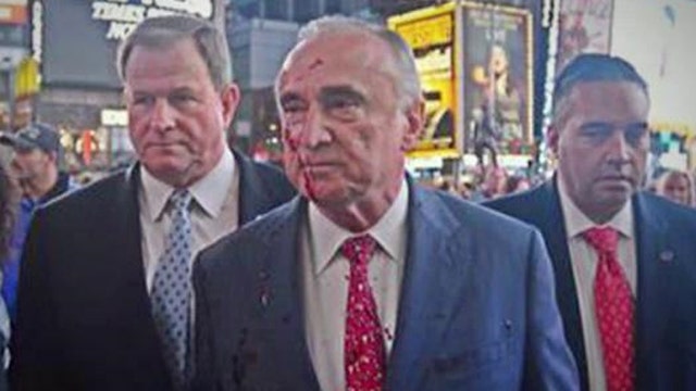 Man throws fake blood on NYPD Chief Bratton during protest