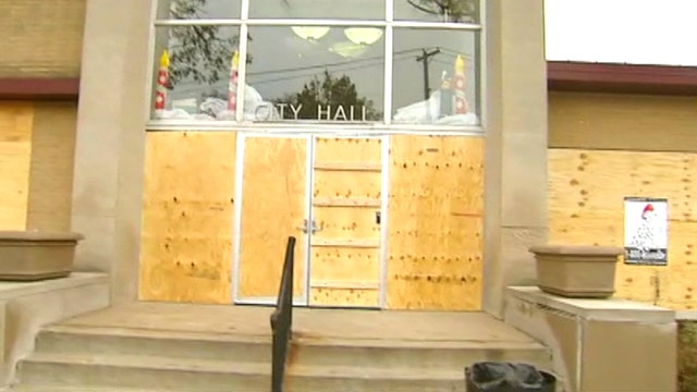 City Hall boarded up after night of protests in Ferguson
