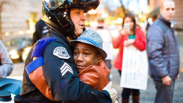 Photo of boy hugging police officer goes viral