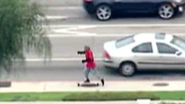 The skate escape: Car chase suspect flees on skateboard