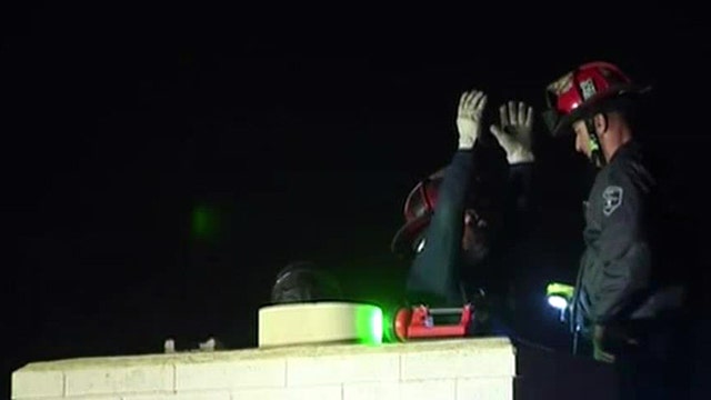 Arizona rescuers pull trapped teen from chimney