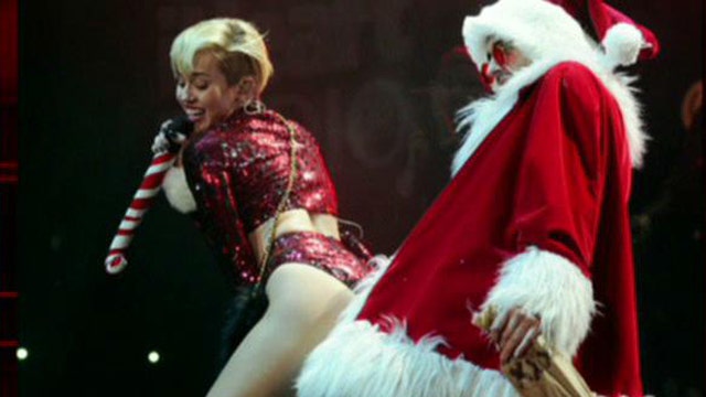 Miley twerks on Santa during concert