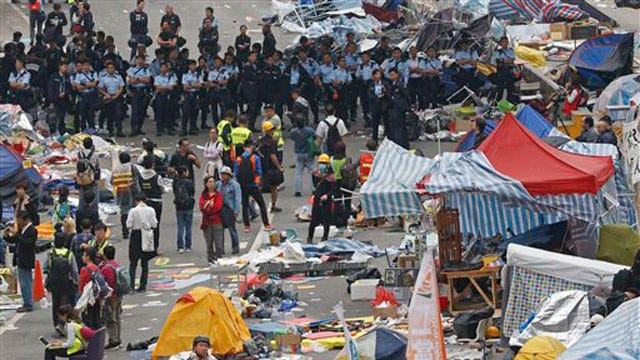 Tensions mount as police clear out Hong Kong protest camps