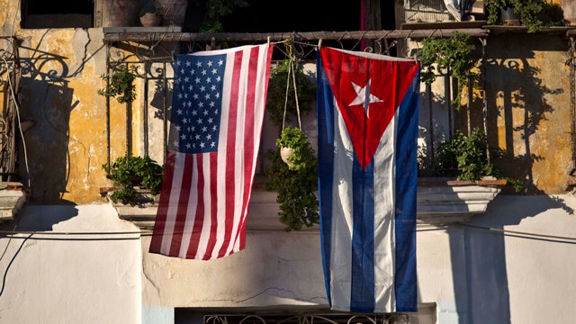 Mixed reaction to shift on Cuba