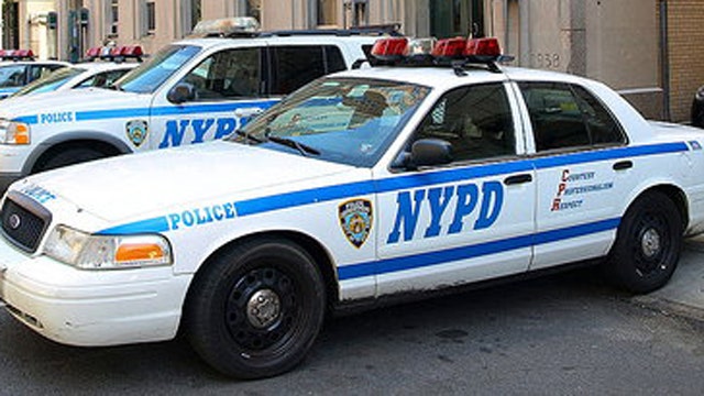 NYPD officers shot in patrol car, in critical condition
