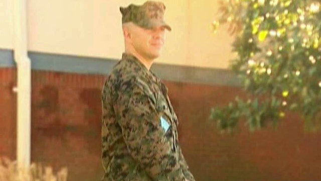 Marine dad stands guard outside children's school