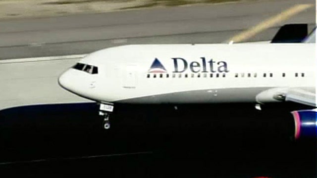 Delta employee charged with smuggling loaded guns on planes