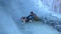 Man, dog pulled from icy lake in Michigan