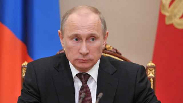 Putin signs law banning adoptions by American families