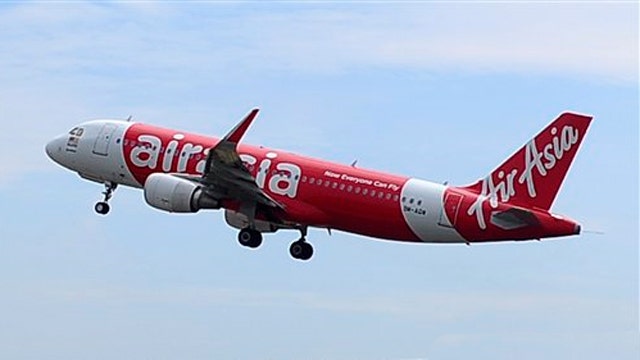 Search suspended for missing AirAsia jet due to weather