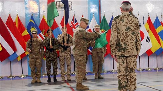 US and NATO mark end to combat operation in Afghanistan