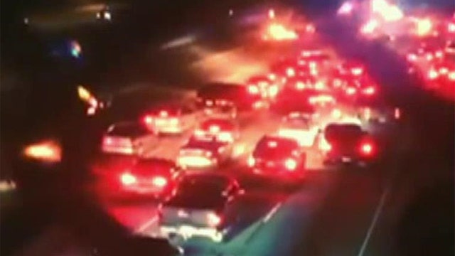 Illegal street race blocks traffic in Los Angeles