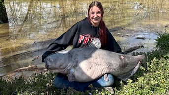 Teen may have set state record after nabbing massive catfish that nearly flipped her boat