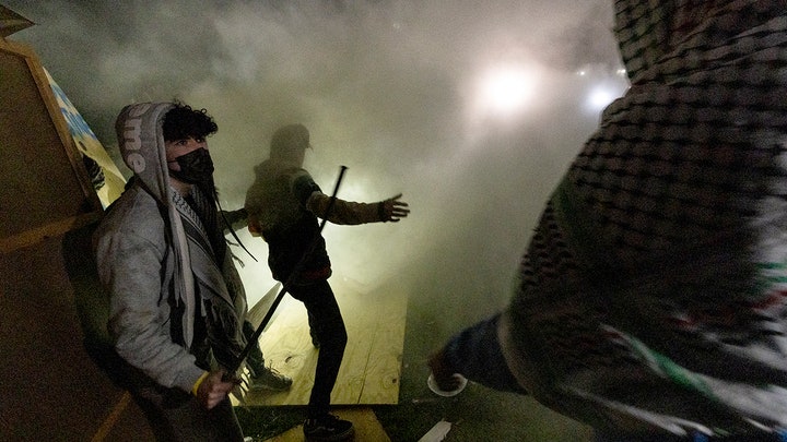Riot police storm anti-Israel encampment at UCLA after mob turns violent