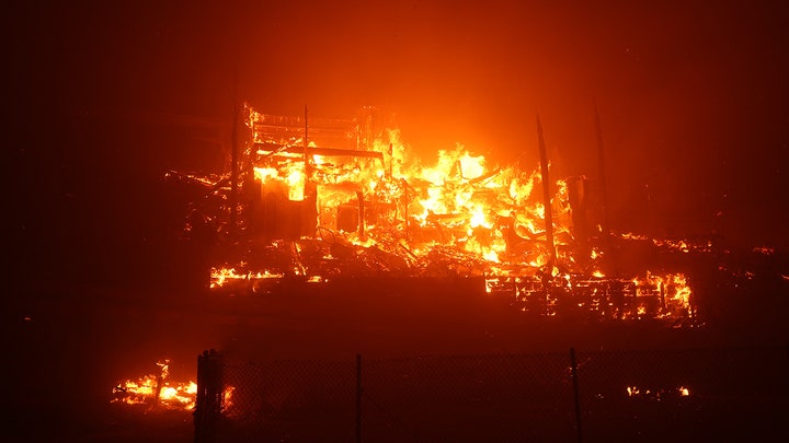 building burning on hill, chain link fence - Fox News