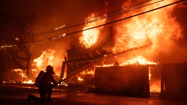 burning building with firefighter - Fox News