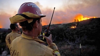 Calif. power company says it may have ignited pair of fast-moving Orange Country wildfires
