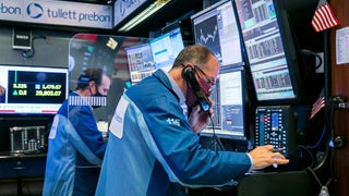 Dow dips as Home Depot falls, Tesla up on S&P inclusion