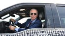 US President Joe Biden drives the new electric Ford F-150 Lightning at the Ford Dearborn Development Center in Dearborn, Michigan on May 18, 2021. (Photo by Nicholas Kamm / AFP) (Photo by NICHOLAS KAMM/AFP via Getty Images)
