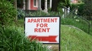 Apartment for rent sign displayed on residential street. Shows demand for housing, rental market, landlord-tenant relations.