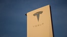 The Tesla, Inc. logo is displayed on a sign outside the Tesla Design Center in Hawthorne, California, on August 9, 2022. - Elon Musk has sold nearly $7 billion worth of Tesla shares, according to legal filings published August 9, 2022, amid a high-stakes legal battle with Twitter over a $44 billion buyout deal.