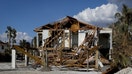 A destroyed house following Hurricane Ian in Fort Myers Beach, Florida, US, on Tuesday, Oct. 4, 2022. Florida cities looking to rebuild from the devastation of Hurricane Ian will be financing their efforts during the worst environment for municipal borrowing in more than a decade. 