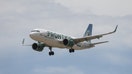 A Frontier Airlines flight prepares to land at Denver International Airport in Denver, Colorado, US, on Wednesday, June 29, 2022. 