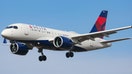 Delta Air Lines Airbus A220-100 aircraft as seen on final approach landing with landing gear down at New York JFK John F. Kennedy International Airport on 14 November 2019 in New York, US. The airplane has the registration N121DU, 2x PW jet engines. The renamed Airbus A220 airliner was Bombardier CS100, BD-500-1A10. Delta Air Lines DL Delta is the largest airline carrier in the world with a hub in New York-JFK. 