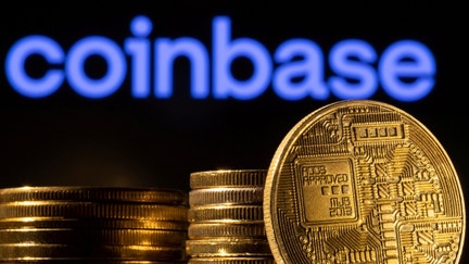 FILE PHOTO: A representation of the cryptocurrency is seen in front of Coinbase logo in this illustration taken, March 4, 2022. 