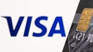 Credit card is seen in front of displayed Visa logo in this illustration taken, on July 15, 2021. 