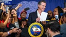 Los Angeles, CA - September 28:Gov. Gavin Newsom signs legislation raising California fast food workers minimum wage to $20 an hour at SEIU Local 721 in Los Angeles on Thursday, September 28, 2023. Newsom gave Anneisha Williams, who works at Jack in the Box and is a mother of six, a copy of the bill. (Photo by Sarah Reingewirtz/MediaNews Group/Los Angeles Daily News via Getty Images)