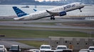 Boston, MA - November 13: A JetBlue flight takes off from Logan Airport. 