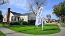 An &quot;Open House&quot; flag is seen in front of a home for sale in Alhambra, California on January 18, 2024. Mortgage rates this week have dropped to its lowest level in eight months for potential US homebuyers but affordability remains a challenge.