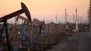 Oil rig pumpjacks extract crude from Wilmington Oil Field near Long Beach, California, on July 30, 2013.
