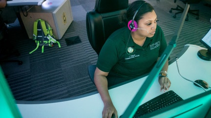 Communications officer Taylor Fuselier works in the Harris County 911 Call Center on May 18, 2021, in Houston.