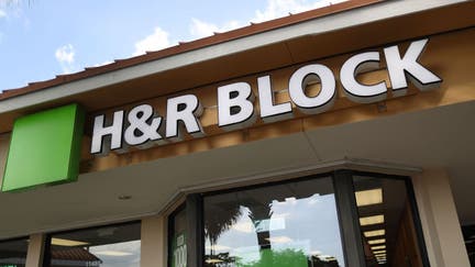A H&R Block office is seen on the day President Donald Trump signed the Republican tax cut bill in Washington, DC on December 22, 2017 in Miami, Florida. Kathy Pickering, vice president of regulatory affairs and executive director of The Tax Institute at H&R Block released a statement about the new tax bill saying, " It's going to change the way you think about and plan your income taxes. You'll need to take a fresh look at your individual situation to know your outcome and new strategies to use to get the best tax outcome."